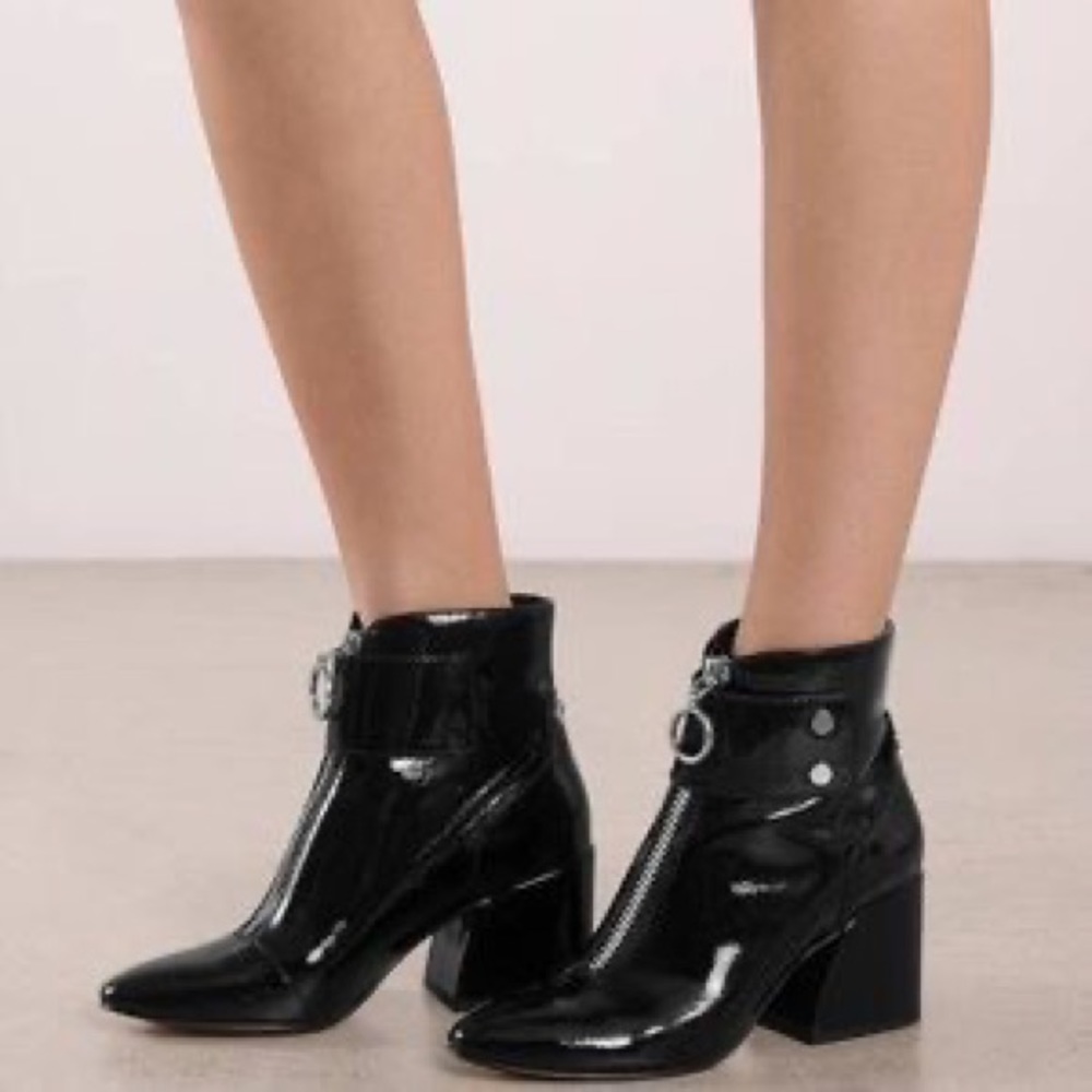 Black patent leather booties with silver zipper